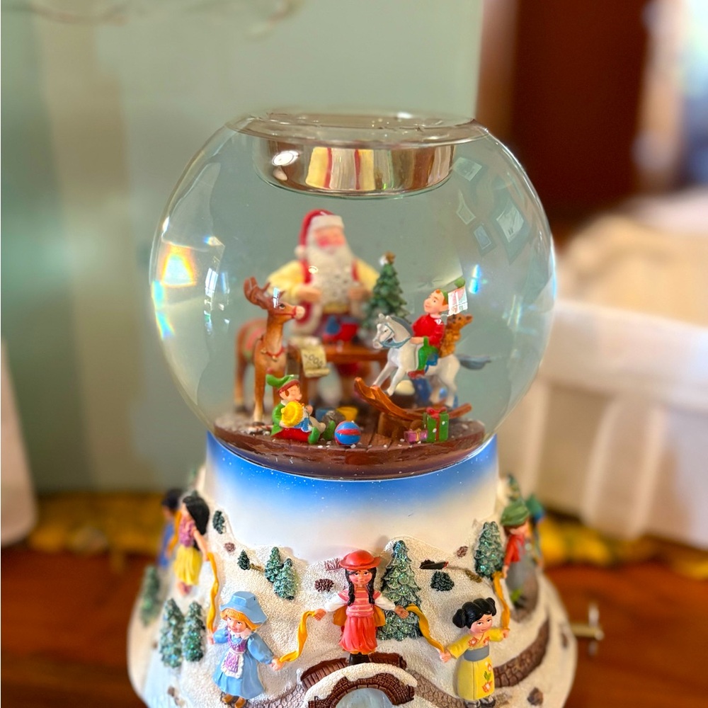 Retired Partylite musical Santa’s workshop water globe.